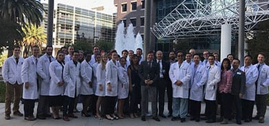 Dr. Calobrace at UCLA posing with students and professors